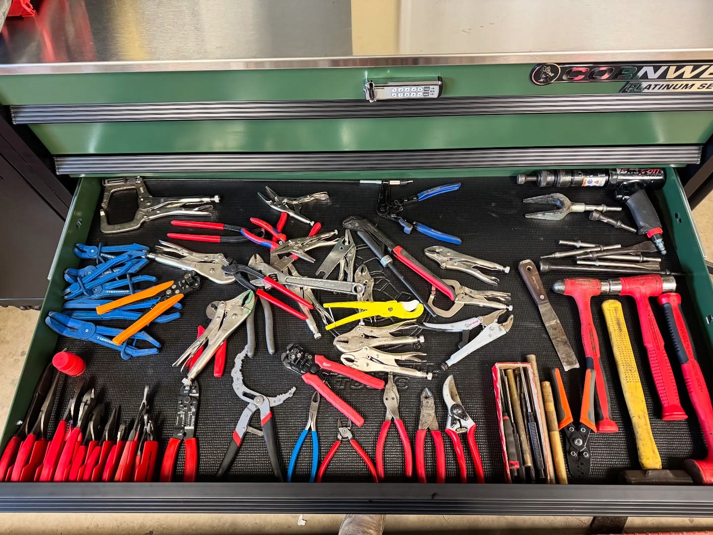A technician's Cornwell toolbox drawer full of pliers and cutters, stocked from the Tool Co truck