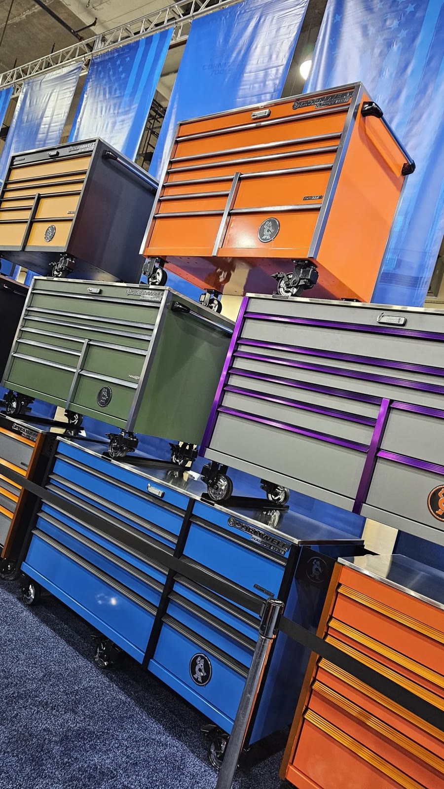 Cornwell toolboxes in orange, green, purple, and blue stacked on display, the kind of tool storage Tool Co offers financing on for Rio Grande Valley shops